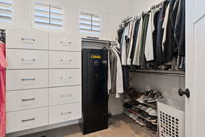 Spacious closet featuring carpet flooring