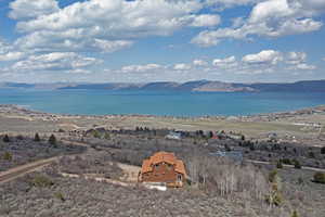 Aerial view featuring a water and mountain view