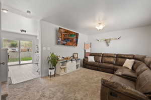 Living room with baseboards and carpet flooring