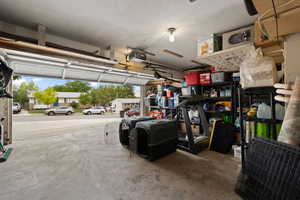 Garage featuring a garage door opener