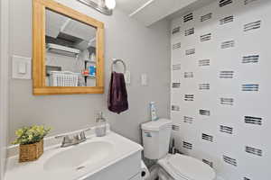 Half bath with vanity and toilet