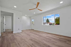 Living room with recessed lighting, ceiling fan, baseboards, and light wood-style flooring