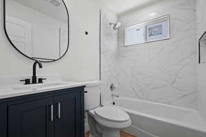 Full bathroom featuring visible vents, shower / bathtub combination, vanity, and toilet