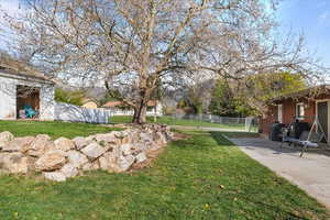 View of yard featuring fence