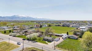 Birds eye view of property with a mountain view and a residential view