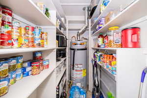 Storage area featuring gas water heater