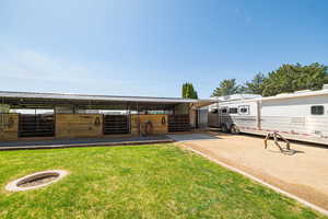 View of vehicle parking featuring an exterior structure