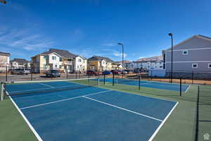 View of sport court featuring fence
