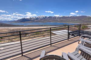 Balcony with a water and mountain view