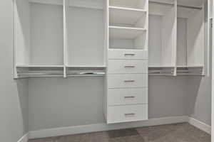 Walk in closet featuring carpet