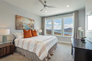 Bedroom with baseboards, light carpet, ceiling fan, and recessed lighting