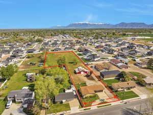 Birds eye view of property with a residential view and a mountain view