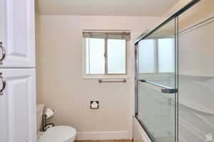 Bathroom has tub/shower and an additional shower.  Could be divided into two bathrooms.