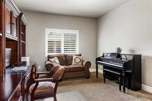 Office space featuring baseboards and carpet flooring