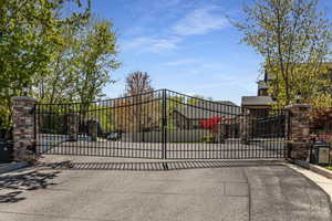 View of gate featuring fence
