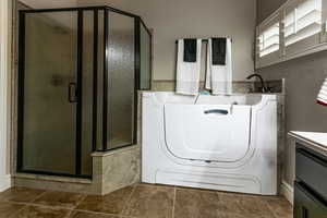 Laundry room featuring laundry area and washer / dryer