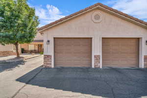 Garage with asphalt driveway