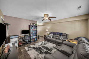 Living area featuring an office area and ceiling fan