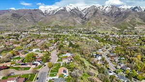 Birds eye view of property with a residential view and a mountain view