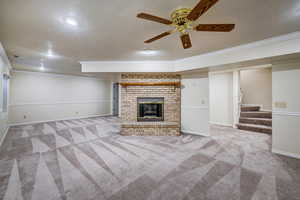 Basement living room featuring a fireplace.