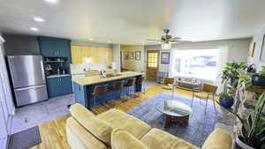 Kitchen featuring recessed lighting, refrigerator, a wealth of natural light.