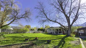 View of yard with a fenced backyard
