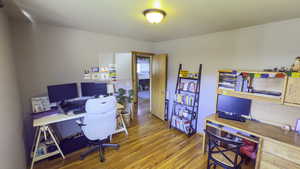 Office with wood finished floors