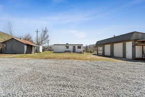 View of yard featuring an outdoor structure and a detached garage
