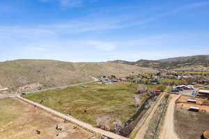 Aerial view featuring a rural view and a mountain view