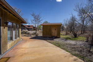 View of patio / terrace with an outbuilding and a shed