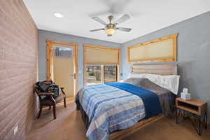 Bedroom featuring ceiling fan, concrete floors, and recessed lighting