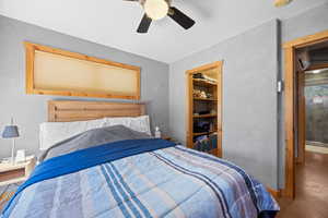 Bedroom with a closet and ceiling fan