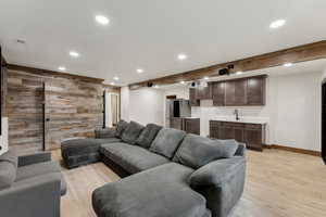Living room featuring recessed lighting and light wood-style flooring