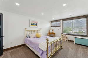 Bedroom featuring baseboards, carpet flooring, and recessed lighting