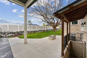 View of patio / terrace featuring a fenced backyard and an outdoor fire pit