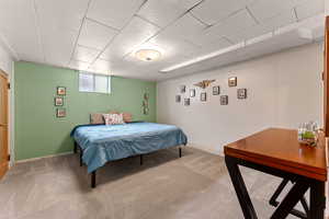 Bedroom with baseboards and carpet flooring
