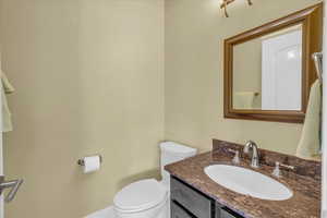 Half bath with vanity and toilet