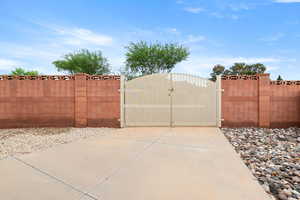 View of gate featuring fence