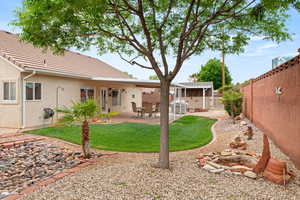 View of yard featuring a patio area and a fenced backyard
