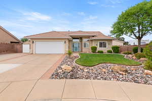 Ranch-style house featuring concrete driveway, a tiled roof, fence, a garage, and stucco siding