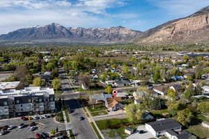 Birds eye view of property with a residential view and a mountain view
