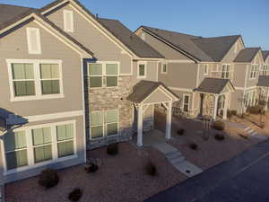 View of property with stone siding
