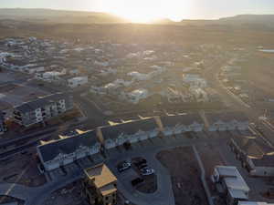 Aerial view at dusk featuring a residential view and a mountain view