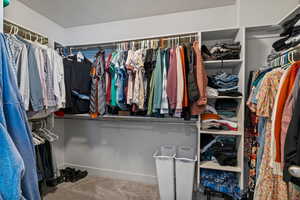 Spacious closet featuring carpet flooring
