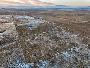 Aerial view featuring a rural view and a mountain view