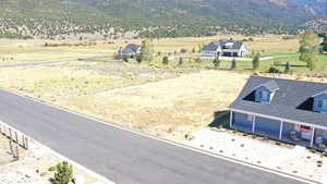 Drone / aerial view featuring a rural view and a mountain view