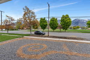 View of road featuring a mountain view and sidewalks