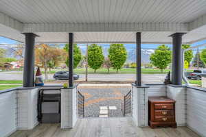 View of patio with a mountain view and covered porch