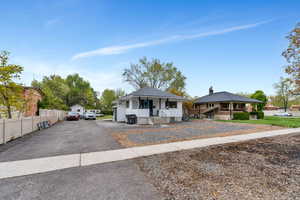 Bungalow-style house with fence