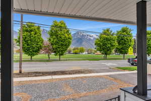 View of street featuring sidewalks, traffic signs, and a mountain view